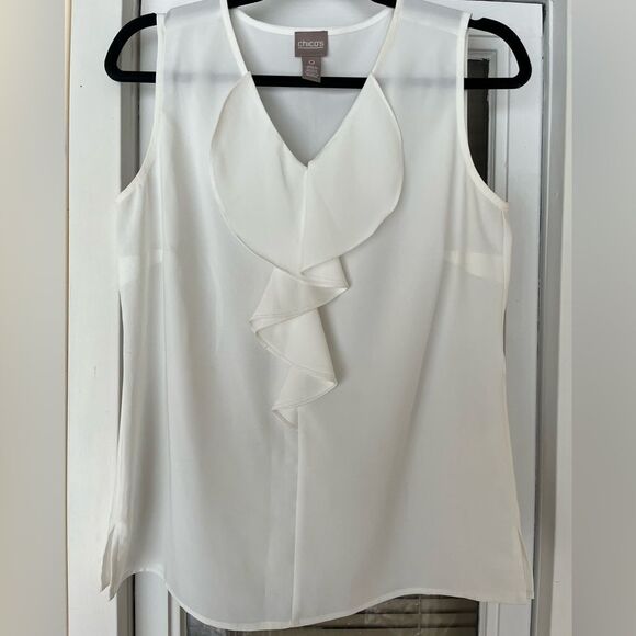 Chico’s white sleeveless v-neck blouse, jabot in front, slits at sides, size 0. - Picture 1 of 7
